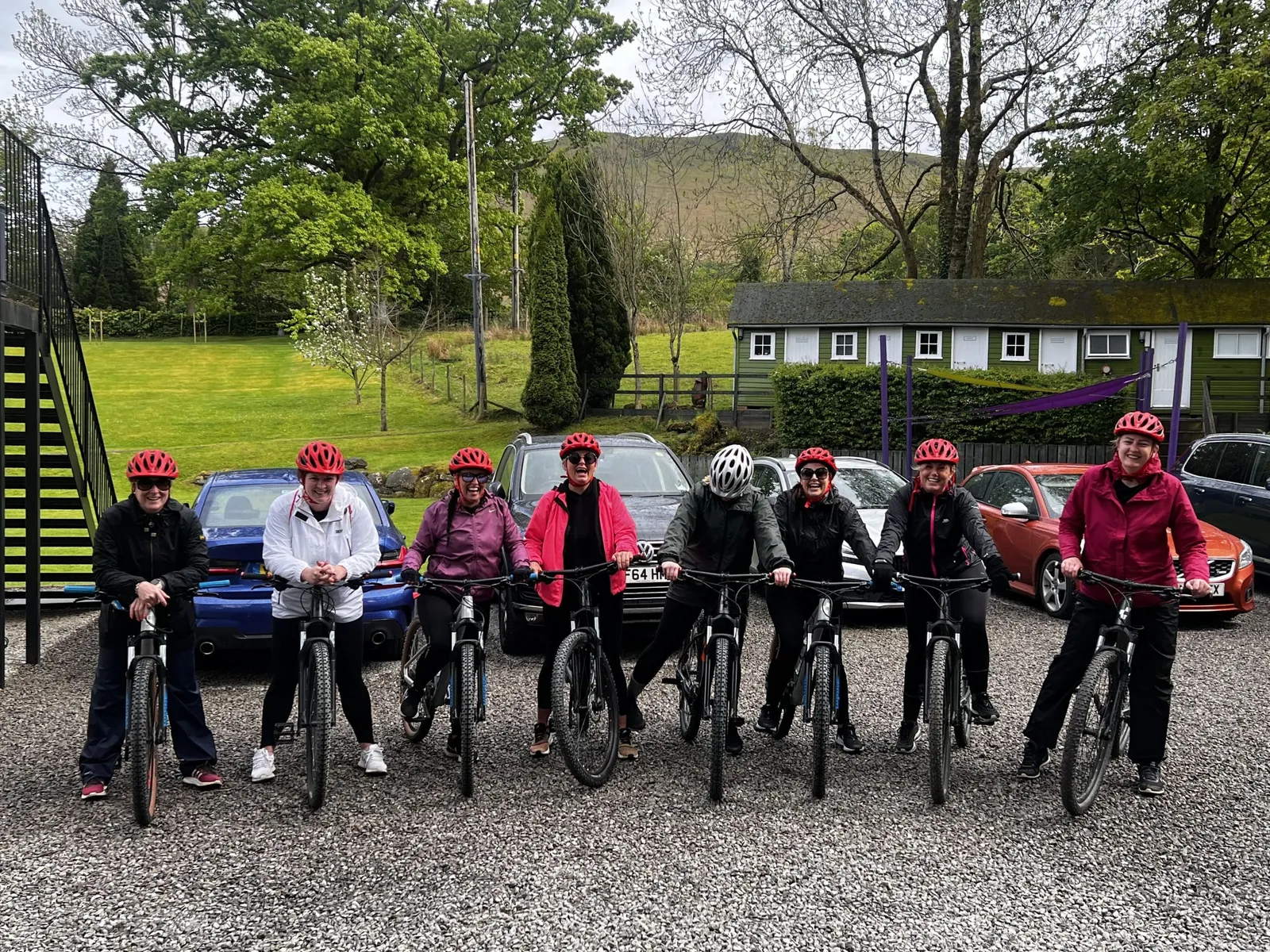A group of women on bikes smiling at the camera